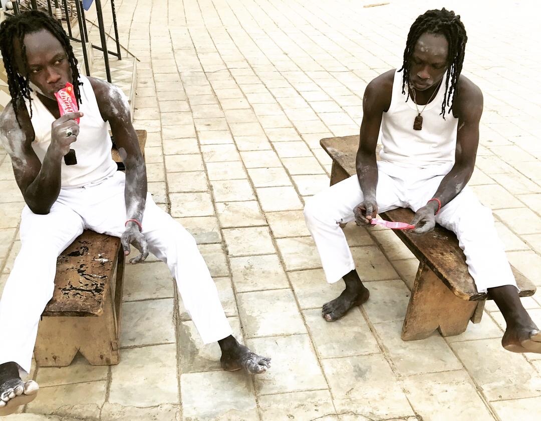 The Mystic Twins in traditional white spiritual attire